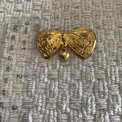 Gold tone bow brooch