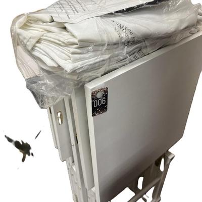 Sale Photo Thumbnail #361: 4 Folding Tray tables with storage stand, and  table cloths   
Great for tv tables, trade shows, craft fairs, etc.
The tables are vey sturdy, whitewash.  Excellent condition
Retails at $200