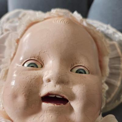 Sale Photo Thumbnail #369: 20 inch doll, composition head, cloth body, sleep eyes, 1920s 
This lovely doll shows signs of her age, see photos