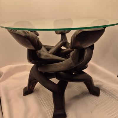 Sale Photo Thumbnail #433: Very unique carved table, from 1 piece of wood.
13 inches tall x 15 inches wide
In good condition
The figures move freely, up and down for possible table height changes 
Retail $200++