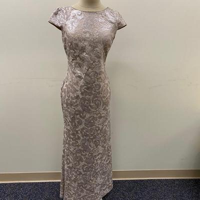 Sale Photo Thumbnail #442: Size 4   Cap Sleeve   Nude lining 
100% polyester lining, polyester exterior
Cream color, side zipper
1 original owner, very good condition
This is a very lovely vintage dress