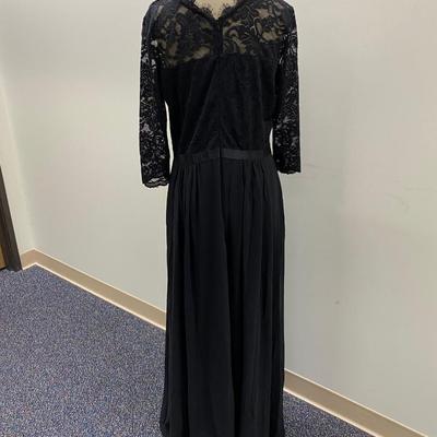 Sale Photo Thumbnail #455: 100% polyester, tea length, elbow length sleeves
Size 14   Drop hem in back
New with tags