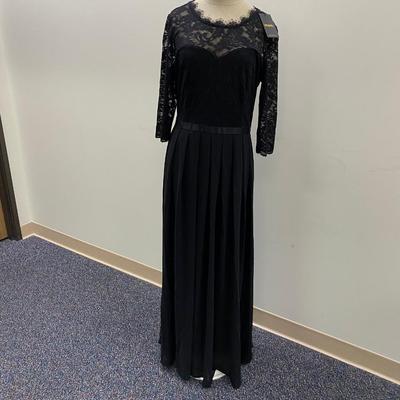 Sale Photo Thumbnail #456: 100% polyester, tea length, elbow length sleeves
Size 14   Drop hem in back
New with tags