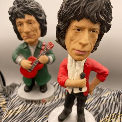 Sale Photo Thumbnail #468: Each Bobblehead features a different member of the iconic rock band, including Mick Jagger, Keith RIchards, Charlie Watts, and Ronnie Wood.  Good condition, sold as is..  Very good condition, no chips.  Approximatey 7 inches tall. The reserve must be met 