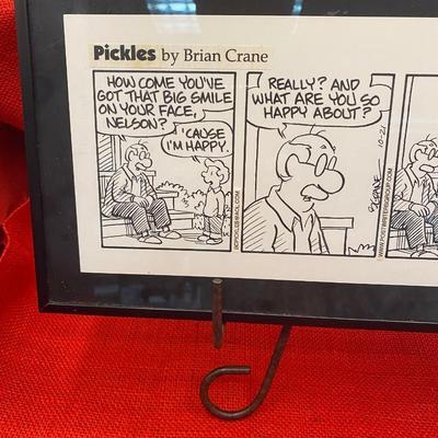 Sale Photo Thumbnail #475: Pickles cartoon by Brian Crane, signed. 
1999, 4 scene comic strip, single mat, framed 
16 x 8 inches