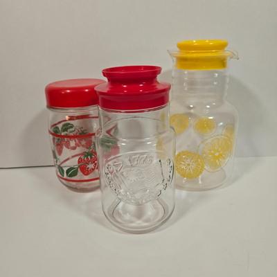 LOT 90D: Vintage Pyrex Glass Lemonade Pitcher, Strawberry Glass Red Lid Candy Jar Canister, and Anchor Hocking 1776 Bicentennial Liberty...