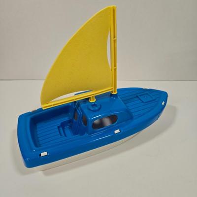 LOT 92D: Vintage Plastic Sailboats, Glass Marbles, Pez Containers, 2 Burger King Jurassic Park Watches, and More