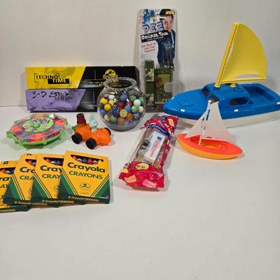LOT 92D: Vintage Plastic Sailboats, Glass Marbles, Pez Containers, 2 Burger King Jurassic Park Watches, and More