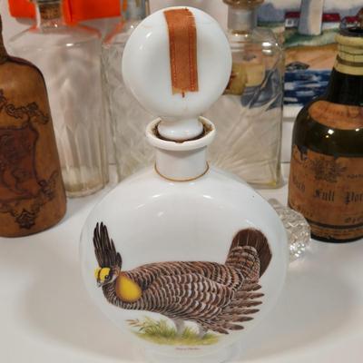 LOT 94D: Vintage Rich Full Port Wine Bottle, Leather Wrapped Decanter, Seagram's 7 Bottle, Field Birds Whiskey Decanter, Ashtrays,...
