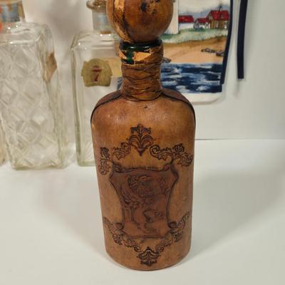 LOT 94D: Vintage Rich Full Port Wine Bottle, Leather Wrapped Decanter, Seagram's 7 Bottle, Field Birds Whiskey Decanter, Ashtrays,...