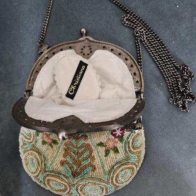 Sale Photo Thumbnail #483: Micro beaded seed mesh purse/bag.  1950s Victorian style 
excellent condition, brand name on mirror 
9 inches clasp to bottom of bag, 22 inch drop