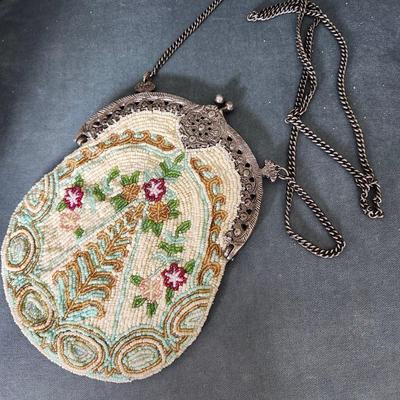 Sale Photo Thumbnail #484: Micro beaded seed mesh purse/bag.  1950s Victorian style 
excellent condition, brand name on mirror 
9 inches clasp to bottom of bag, 22 inch drop