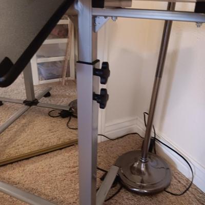 ADJUSTABLE, TILTING LAPTOP DESK ON CASTERS AND A FLOOR LAMP