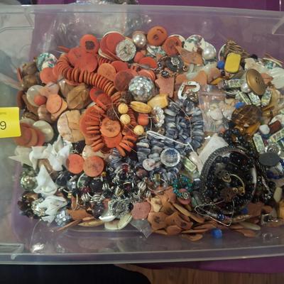 Sale Photo Thumbnail #711: this weighs OVER 15 pounds.  It is mostly buttons but also has some beads and jewelry making pieces.  We took periodic photos as things were added to the tub. The container is included.  Shipping will likely be 16 or 17 pounds and the box will have to be 
