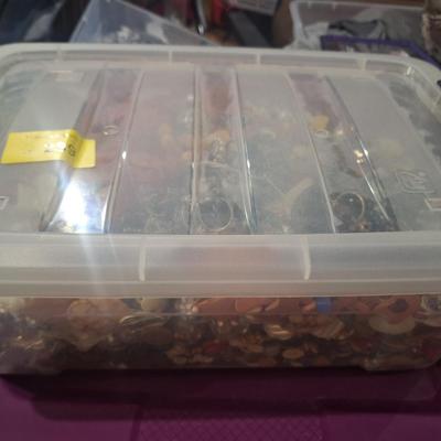 Sale Photo Thumbnail #705: this weighs OVER 15 pounds.  It is mostly buttons but also has some beads and jewelry making pieces.  We took periodic photos as things were added to the tub. The container is included.  Shipping will likely be 16 or 17 pounds and the box will have to be 