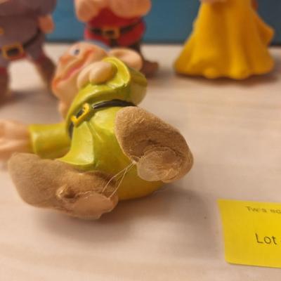 Sale Photo Thumbnail #815: There is only 6 dwarves. Also all of these have some hot glue on the bottom like they used to be glued to something.
