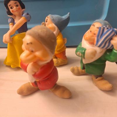 Sale Photo Thumbnail #818: There is only 6 dwarves. Also all of these have some hot glue on the bottom like they used to be glued to something.