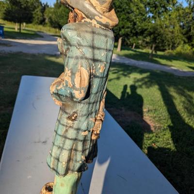Sale Photo Thumbnail #183: approx 30 inches tall, he's got a card in his hat, he's reaching for a hidden gun and there is a knife hidden in a pocket.  He show a lot of wear from being outside but he is a fun statue to have.