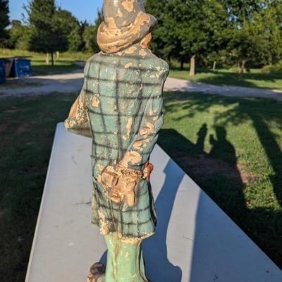 Sale Photo Thumbnail #181: approx 30 inches tall, he's got a card in his hat, he's reaching for a hidden gun and there is a knife hidden in a pocket.  He show a lot of wear from being outside but he is a fun statue to have.