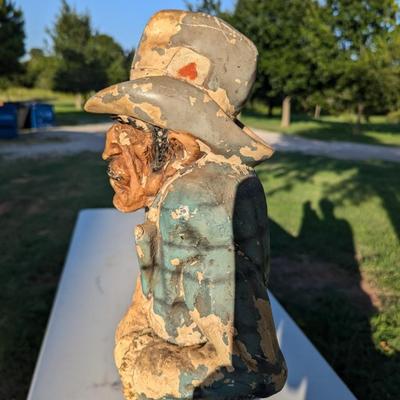 Sale Photo Thumbnail #182: approx 30 inches tall, he's got a card in his hat, he's reaching for a hidden gun and there is a knife hidden in a pocket.  He show a lot of wear from being outside but he is a fun statue to have.
