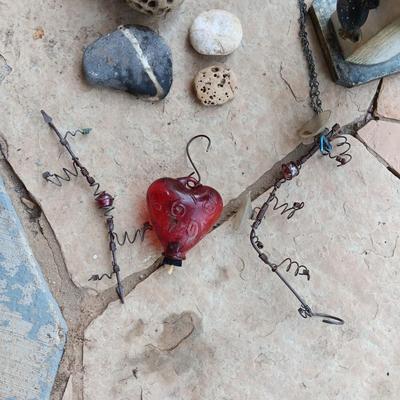 A UNIQUE BIRDHOUSE, HUMMINGBIRD FEEDERS AND SOME UNUSUAL ROCKS