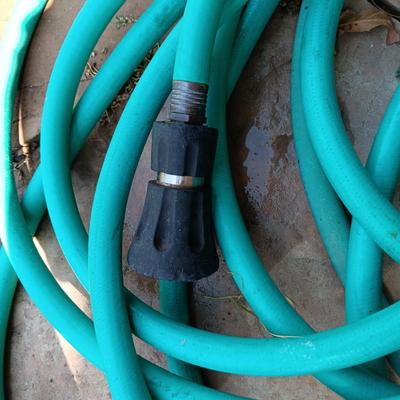 2 GARDEN HOSES AND A NICE POWERFUL SPRAYER
