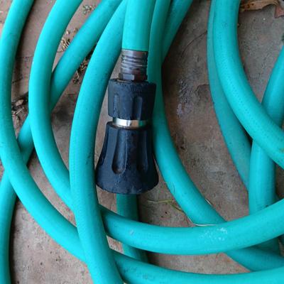 2 GARDEN HOSES AND A NICE POWERFUL SPRAYER