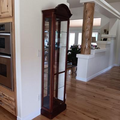 HOWARD MILLER LIGHTED NARROW CURIO CABINET WITH MIRRORED BACK