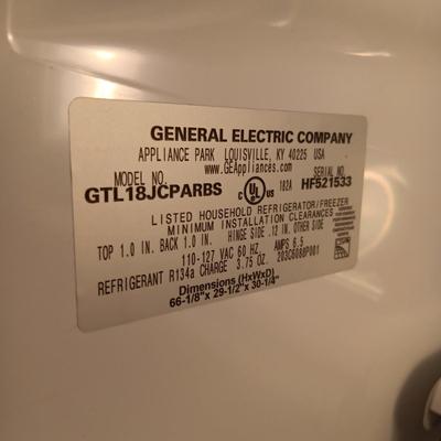 GE STAINLESS STEEL REFRIGERATOR WITH ICEMAKER (CONTENTS NOT INCLUDED)