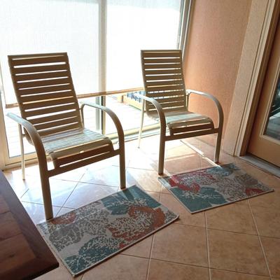 2 LIKE NEW PATIO CHAIRS AND 2 RUGS