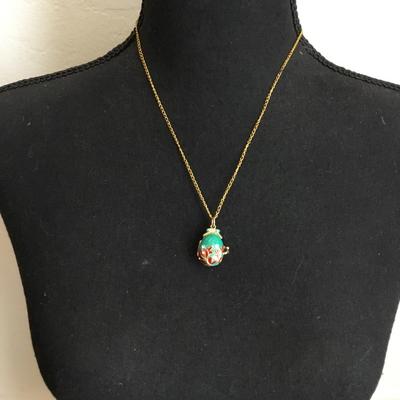 Vintage Russian pendant, egg, elaborate designs women’s with leaves and crystals Gold tone, teddy bear inside