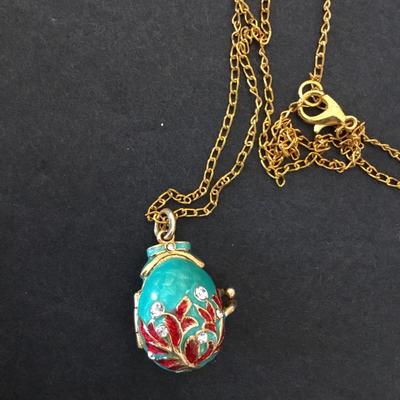 Vintage Russian pendant, egg, elaborate designs women’s with leaves and crystals Gold tone, teddy bear inside