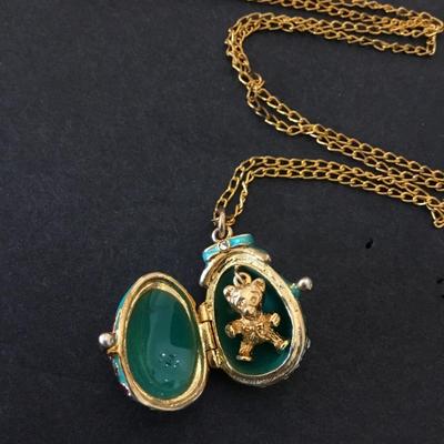 Vintage Russian pendant, egg, elaborate designs women’s with leaves and crystals Gold tone, teddy bear inside