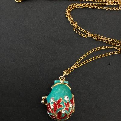Vintage Russian pendant, egg, elaborate designs women’s with leaves and crystals Gold tone, teddy bear inside