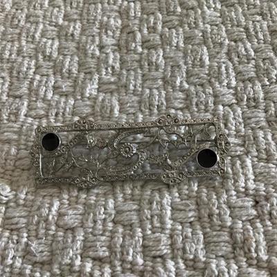 Large silver tone scroll brooch