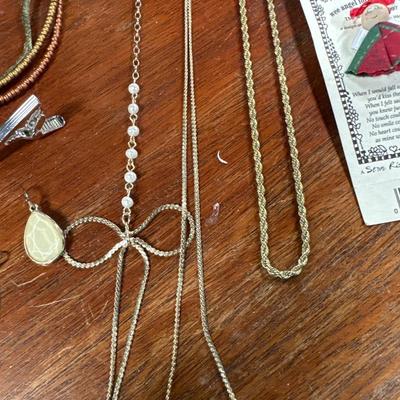 Sale Photo Thumbnail #126: Gold tone necklaces, silver tone bracelet
Pins and earrings . Lot