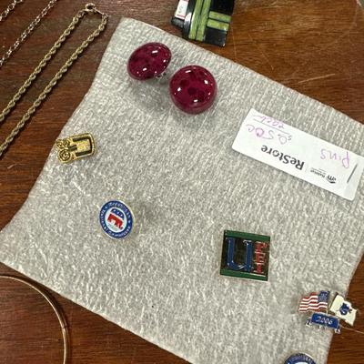 Sale Photo Thumbnail #125: Gold tone necklaces, silver tone bracelet
Pins and earrings . Lot