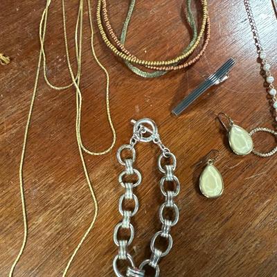 Sale Photo Thumbnail #124: Gold tone necklaces, silver tone bracelet
Pins and earrings . Lot