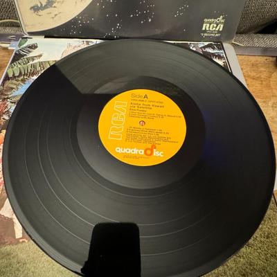 Sale Photo Thumbnail #55: Elvis Presley's Aloha from Hawaii via Satellite, a historic live album released by RCA Records in February 1973. 
Here's more about this iconic album:
Pioneering Satellite Broadcast: This album captures the performance from Elvis Presley's groundbreaking 