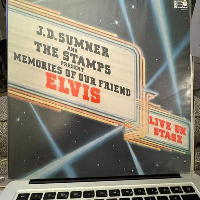 Sale Photo Thumbnail #148: "J.D. Sumner and The Stamps Present Memories of Our Friend Elvis Live On Stage". 
Here's some information about this vinyl record:
Artists: J.D. Sumner & The Stamps, and The TCB Band.
Album Title: Memories Of Our Friend Elvis.
Format: It is a 2xLP (double