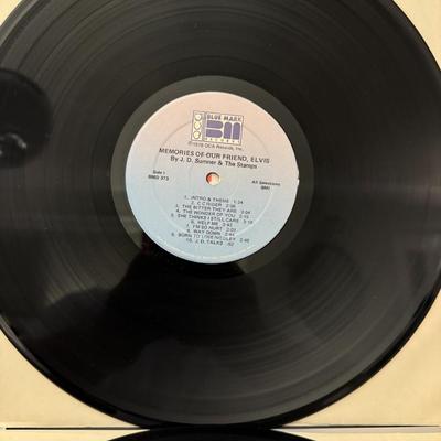 Sale Photo Thumbnail #146: "J.D. Sumner and The Stamps Present Memories of Our Friend Elvis Live On Stage". 
Here's some information about this vinyl record:
Artists: J.D. Sumner & The Stamps, and The TCB Band.
Album Title: Memories Of Our Friend Elvis.
Format: It is a 2xLP (double