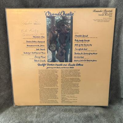 Sale Photo Thumbnail #279: "Oz And Charlie" by Bashful Brother Oswald and Charlie Collins. 
Here are some details about this album:
Artists: Bashful Brother Oswald and Charlie Collins.
Title: Oz And Charlie.
Release Year: 1976.
Label: Rounder Records.
Genre & Style: Primarily Folk,