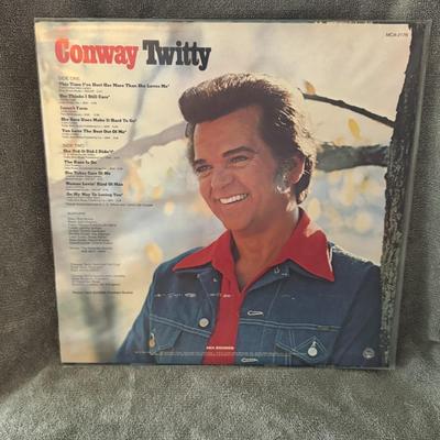 Sale Photo Thumbnail #233: "This Time I've Hurt Her More Than She Loves Me" by Conway Twitty. 
Additional information about the album includes:
Artist: Conway Twitty, a well-known American country music artist.
Album Title: This Time I've Hurt Her More Than She Loves Me.
Release Ye