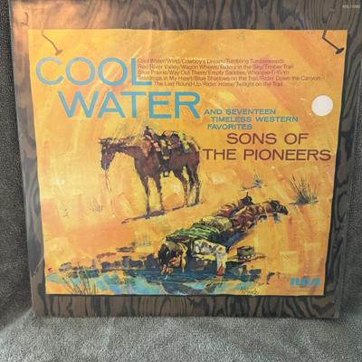 Sale Photo Thumbnail #384: "Cool Water" by Sons of the Pioneers, released on the RCA Records label. 
About the Album:
Artist: The Sons of the Pioneers were a legendary American Western vocal group known for their harmonious sound and cowboy-themed songs, founded by Roy Rogers in 19