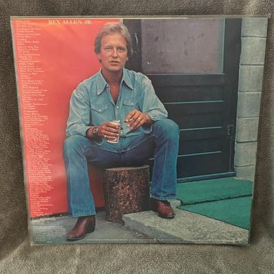Sale Photo Thumbnail #389: "The Best of Rex" by Rex Allen Jr.. 
Here are some details about this album and artist:
Artist: Rex Allen Jr., son of the famous "Arizona Cowboy," Rex Allen Sr..
Album Title: The Best of Rex.
Label and Release: It was released on Warner Brothers Records i