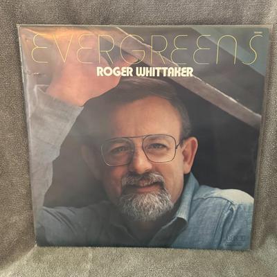Sale Photo Thumbnail #288: "Evergreens" by Roger Whittaker. 
Here's some information about the album:
Artist: Roger Whittaker.
Album Title: Evergreens.
Format: This is a 2xLP (double vinyl record) set.
Release Year: It was released in 1979.
Record Label: RCA Records.