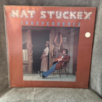 Sale Photo Thumbnail #298: "Independence" by Nat Stuckey, a country music artist. 
Here are some details about the album:
Artist: Nat Stuckey.
Title: Independence.
Year of Release: 1976.
Format: 12" Vinyl LP (33 RPM).
Record Label: MCA Records, with catalog number MCA-2184.
Genre &