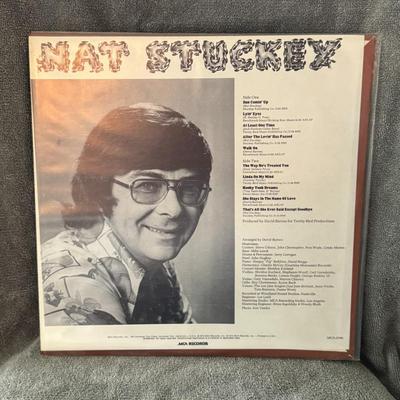 Sale Photo Thumbnail #299: "Independence" by Nat Stuckey, a country music artist. 
Here are some details about the album:
Artist: Nat Stuckey.
Title: Independence.
Year of Release: 1976.
Format: 12" Vinyl LP (33 RPM).
Record Label: MCA Records, with catalog number MCA-2184.
Genre &