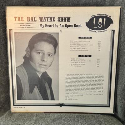 Sale Photo Thumbnail #301: "THE HAL WAYNE SHOW FEATURING My Heart Is An Open Book" by the artist Hal Wayne. The album cover also appears to be autographed by Hal Wayne. 
Here's some information about this record:
Artist: Hal Wayne.
Title: The Hal Wayne Show featuring My Heart Is An