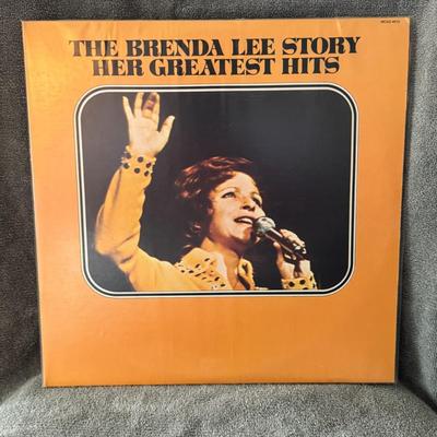 Sale Photo Thumbnail #258: "The Brenda Lee Story: Her Greatest Hits". This is a compilation album by American singer Brenda Lee, released by MCA Records in 1973. 
Here's some information about the album:
Content: This double-LP compilation features 22 of Brenda Lee's most popular s